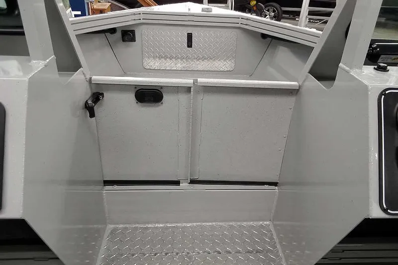 Slide: The Image of 2026 Smoker Craft Phantom 20 X2 boat interior with diamond plate flooring. - 18