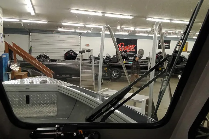 Slide: The Image of 2026 Smoker Craft Phantom 20 X2 in showroom with other boats. - 20