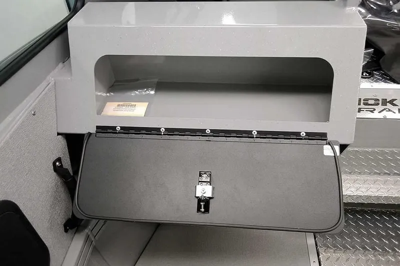 Slide: The Image of 2026 Smoker Craft Phantom 20 X2 storage compartment with open lid and secure latch. - 21