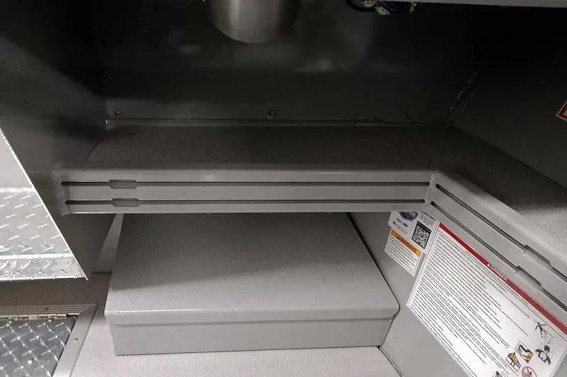 Slide: The Image of Interior view of 2026 Smoker Craft Phantom 20 X2 boat storage compartment. - 28