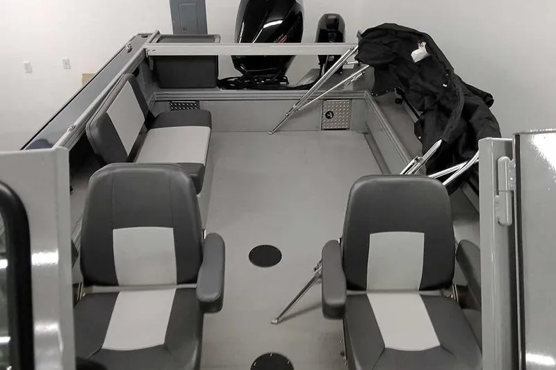 Slide: The Image of 2026 Smoker Craft Phantom 20 X2 boat interior with seating and motor. - 29