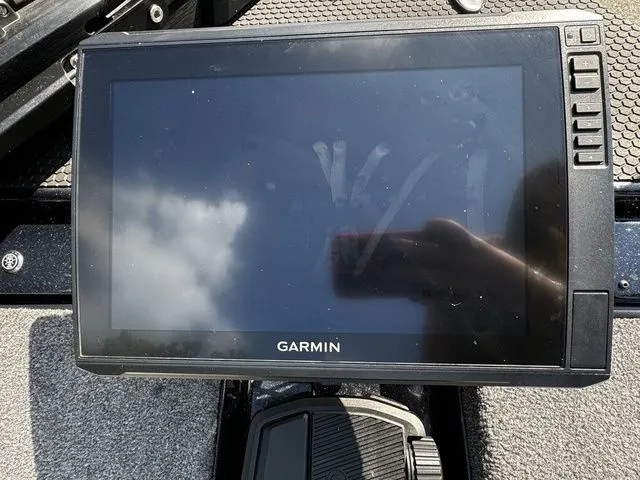 Slide: The Image of Garmin display on 2024 Phoenix Bass Boats 20 XE, showing reflection of sky and hand. - 4