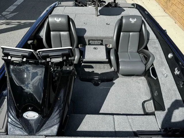 Slide: The Image of 2024 Phoenix Bass Boats 20 XE interior with dual Garmin displays and sleek seating. - 5