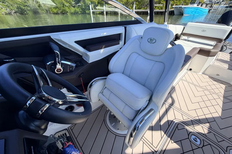 Slide: The Image of 2022 Cobalt R8 Outboard boat interior with luxury seating and steering wheel. - 10
