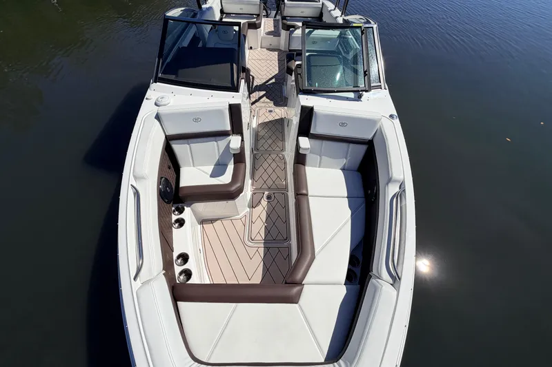 Slide: The Image of 2022 Cobalt R8 Outboard boat with spacious seating and elegant design on calm water. - 17