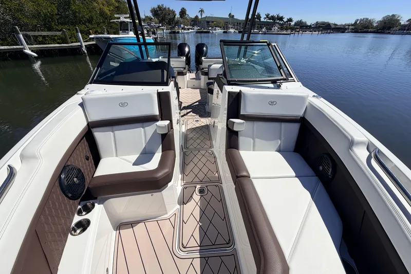 Slide: The Image of 2022 Cobalt R8 Outboard boat interior with luxurious seating and scenic water view. - 18