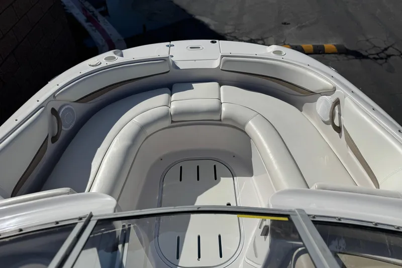 Slide: The Image of 2005 Four Winns 194 Funship boat interior with white seating and speakers. - 14