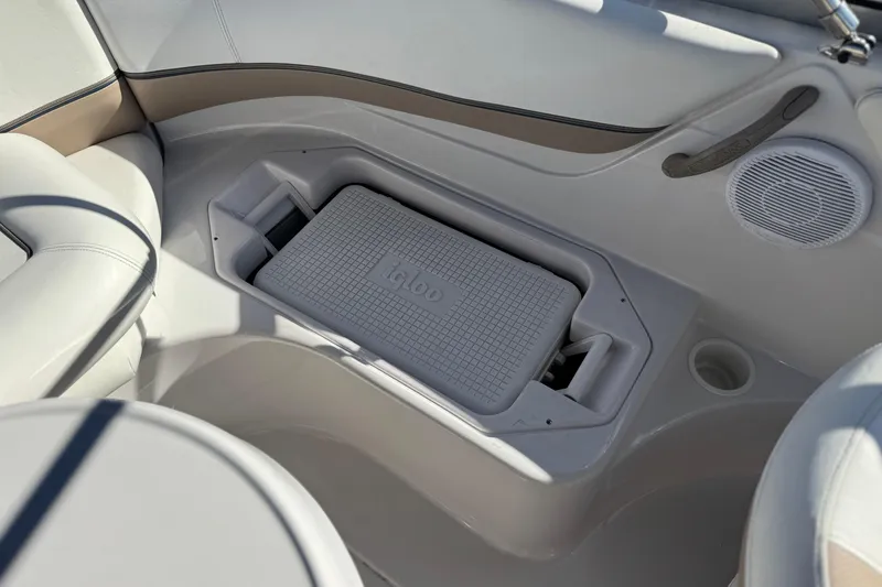 Slide: The Image of 2005 Four Winns 194 Funship boat interior with built-in Igloo cooler and speaker. - 19