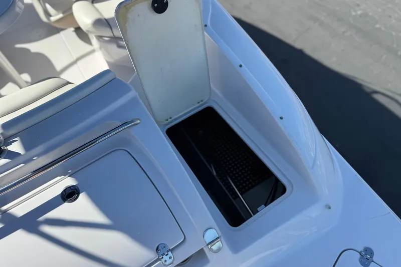 Slide: The Image of Open storage compartment on 2005 Four Winns 194 Funship boat deck. - 8