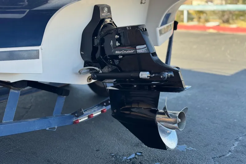 Slide: The Image of 2005 Four Winns 194 Funship boat with MerCruiser outdrive, parked on a trailer. - 9