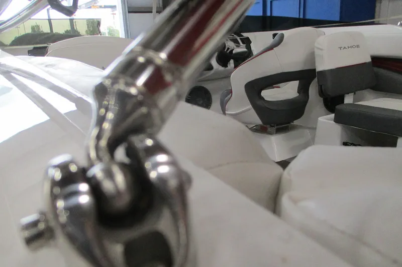 Slide: The Image of 2025 Tahoe 210 S boat interior with sleek seating and polished metal details. - 6