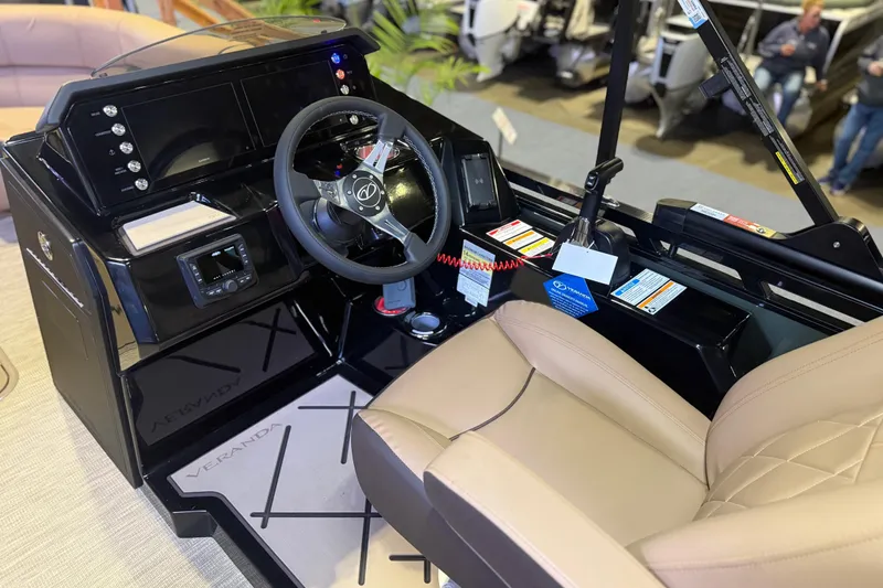 Slide: The Image of 2026 Veranda VX 235 RC boat cockpit with modern controls and beige seating. - 5