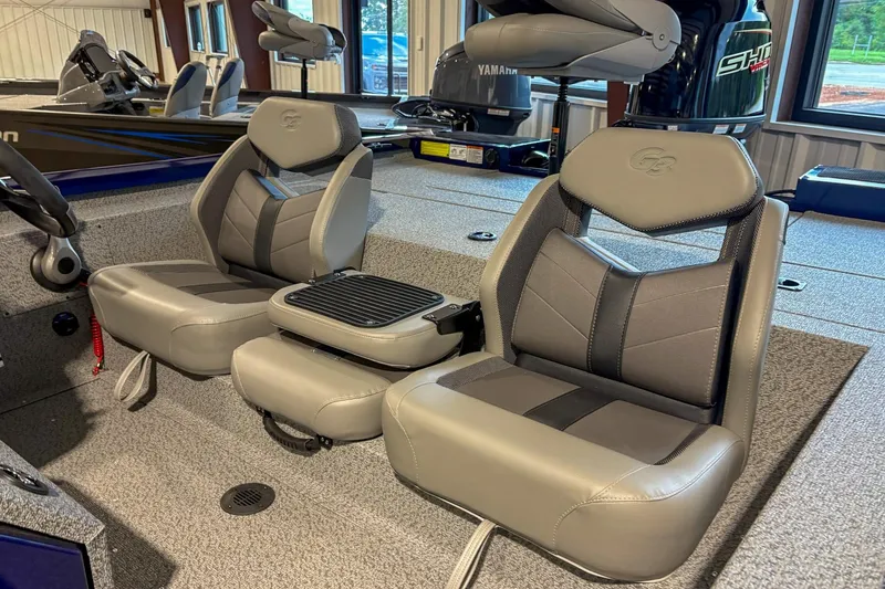 Slide: The Image of 2025 G3 Sportsman 1810 boat interior with dual gray seats and Yamaha motor. - 4