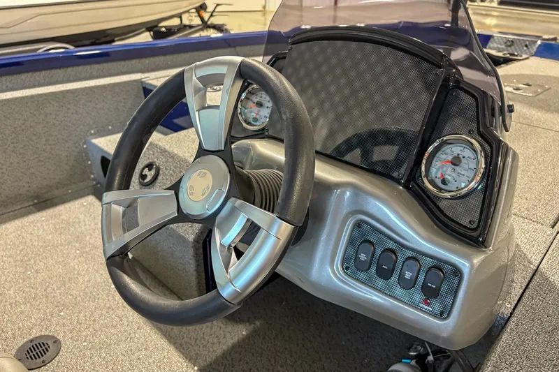 Slide: The Image of 2025 G3 Sportsman 1810 boat dashboard with steering wheel and gauges. - 8