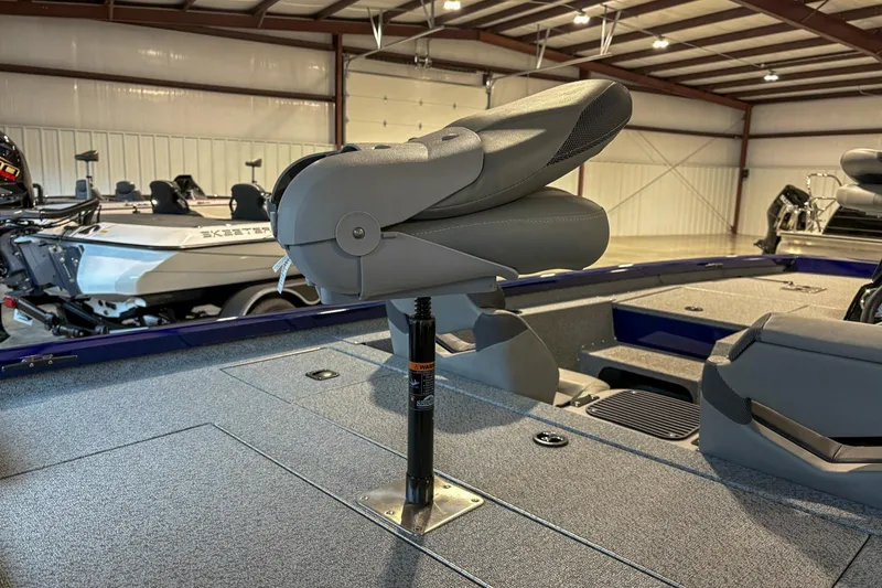 Slide: The Image of 2025 G3 Sportsman 1810 boat interior with adjustable seat in a spacious garage. - 9