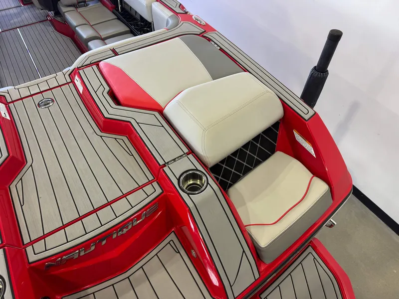 Slide: The Image of Red 2020 Nautique Super Air Nautique GS24 boat interior. - 11