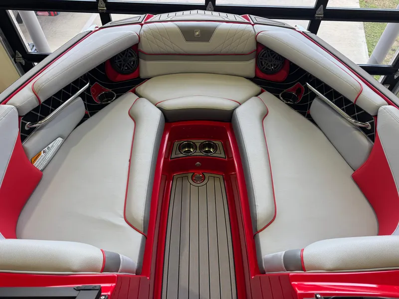 Slide: The Image of Interior of 2020 Nautique Super Air Nautique GS24 with red and gray seating. - 17