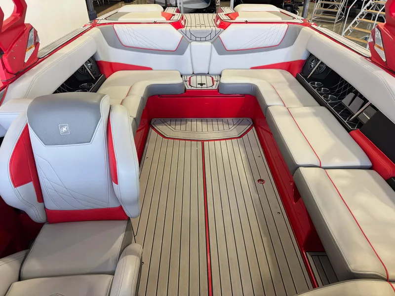 Slide: The Image of Interior of 2020 Nautique Super Air Nautique GS24 with red and gray seating. - 22
