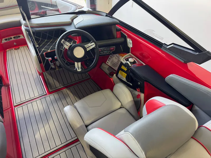 Slide: The Image of Interior of a 2020 Nautique Super Air Nautique GS24 boat, red and gray. - 25