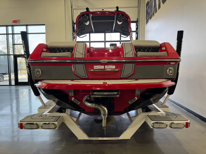 Slide: The Image of Red 2020 Nautique Super Air Nautique GS24 boat in showroom. - 6