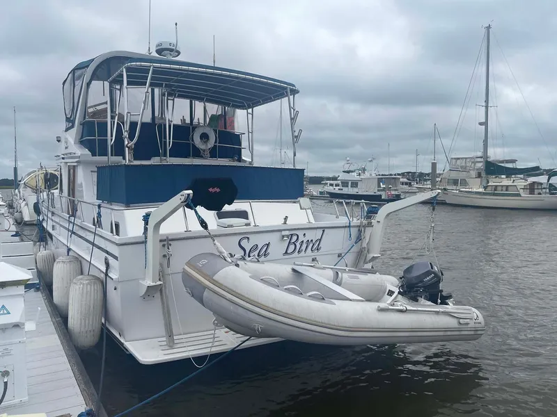Slide: The Image of 1985 DeFever 40 Offshore Cruiser "Sea Bird" docked with inflatable dinghy attached. - 3