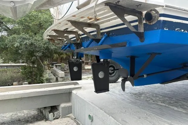 Slide: The Image of 1985 DeFever 40 Offshore Cruiser hull and propellers in dry dock, showcasing marine engineering. - 50