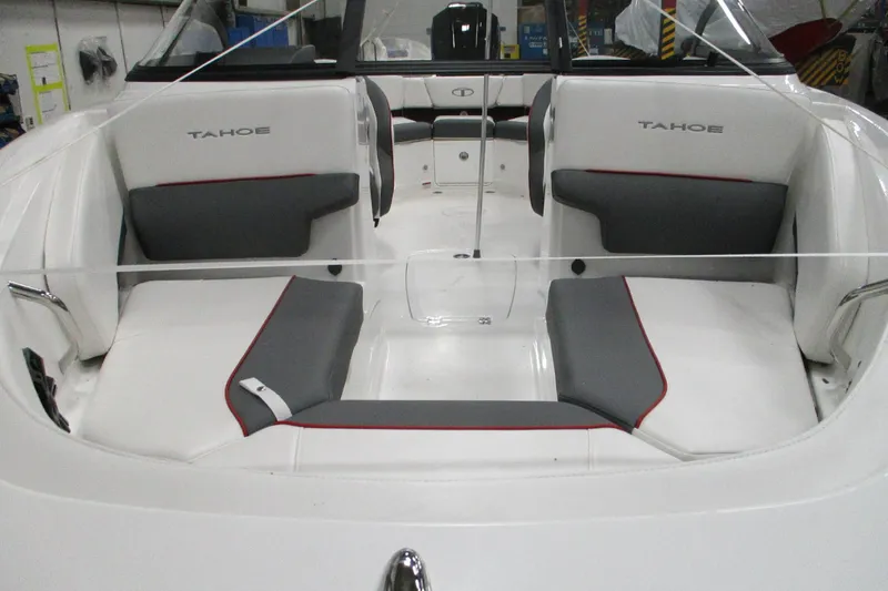 Slide: The Image of 2025 Tahoe 210 S boat interior with white and gray seating, featuring red accents. - 3
