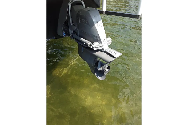 Slide: The Image of 2018 Regal 1900 ESX Bowrider outboard motor in clear water. - 4