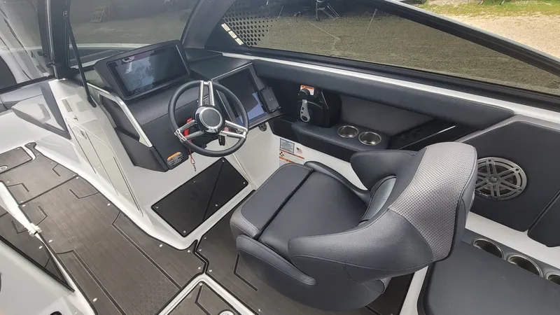 Slide: The Image of Interior of 2023 Scarab 285 ID boat with steering console. - 12