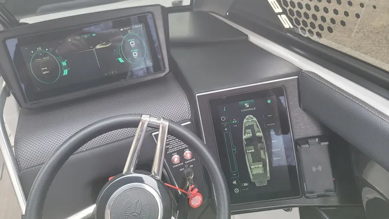 Slide: The Image of 2023 Scarab 285 ID boat cockpit with modern digital displays. - 20