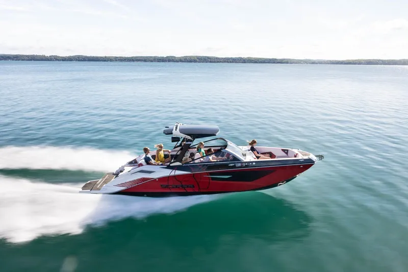 Slide: The Image of 2023 Scarab 285 ID speedboat cruising on water. - 29