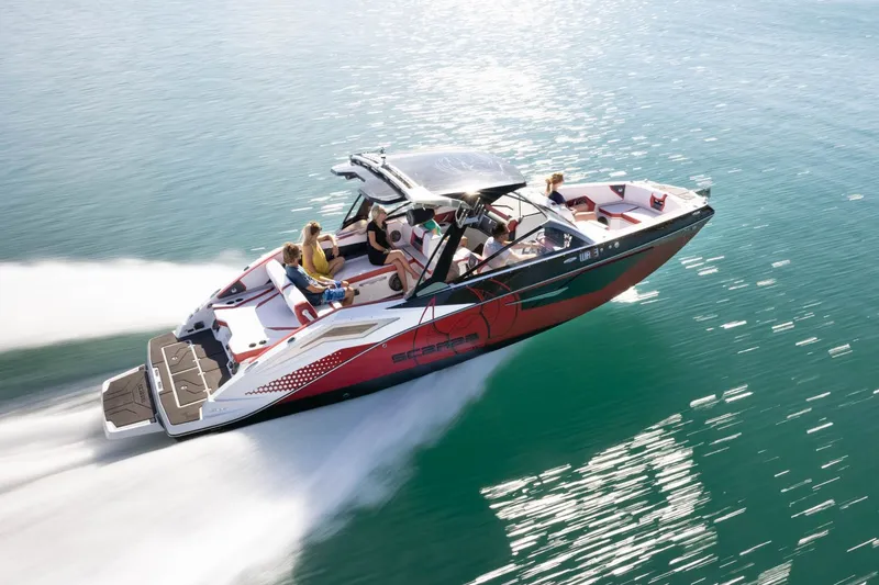 Slide: The Image of 2023 Scarab 285 ID motorboat cruising on water. - 30