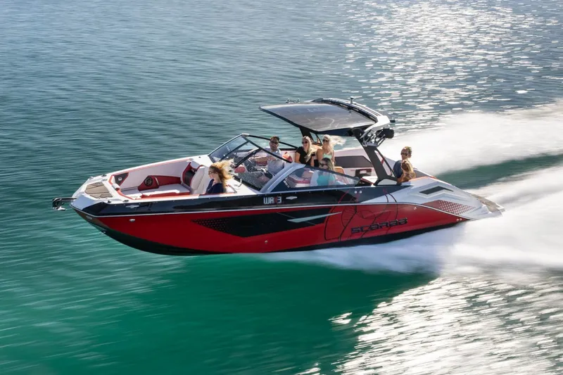 Slide: The Image of 2023 Scarab 285 ID boat on water with passengers. - 32