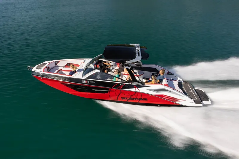 Slide: The Image of 2023 Scarab 285 ID boat speeding on the water. - 34