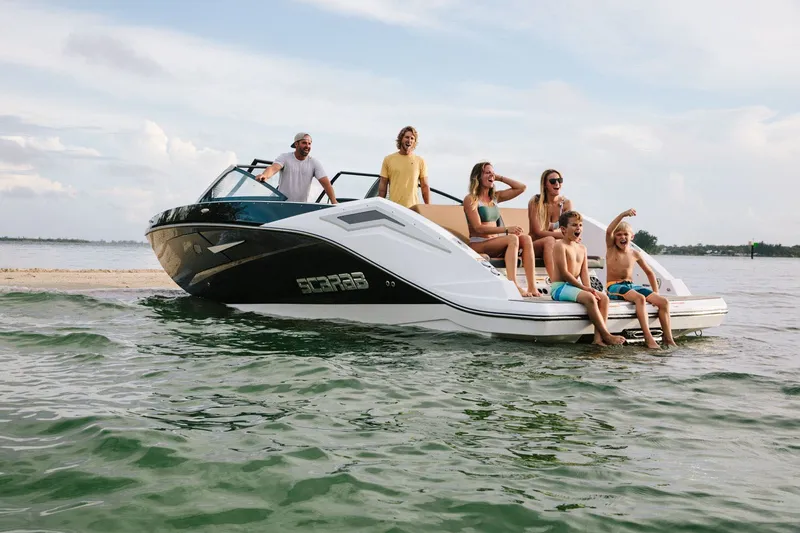 Slide: The Image of 2023 Scarab 285 ID boat with people on the water. - 36