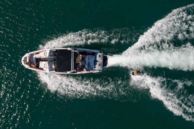 Slide: The Image of Aerial view of Scarab 285 ID boat on water, 2023 model. - 37