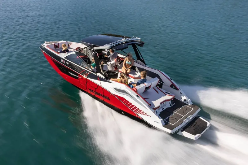 Slide: The Image of 2023 Scarab 285 ID boat on water with passengers. - 45