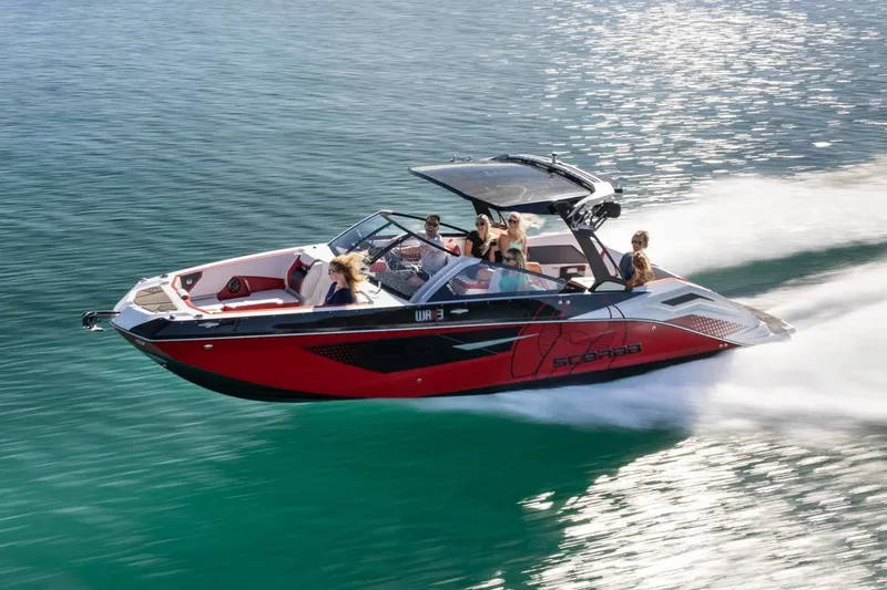 Slide: The Image of 2023 Scarab 285 ID boat on water with passengers. - 46