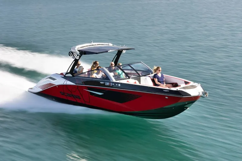 Slide: The Image of 2023 Scarab 285 ID boat speeding on the water. - 47