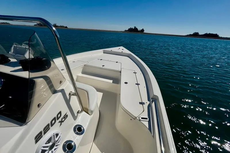 Slide: The Image of 2025 Bulls Bay 2200 XS boat on calm blue water, sunny day. - 5