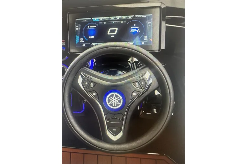 Slide: The Image of Steering wheel and dashboard of 2026 Yamaha Boats 275SD with digital display. - 6
