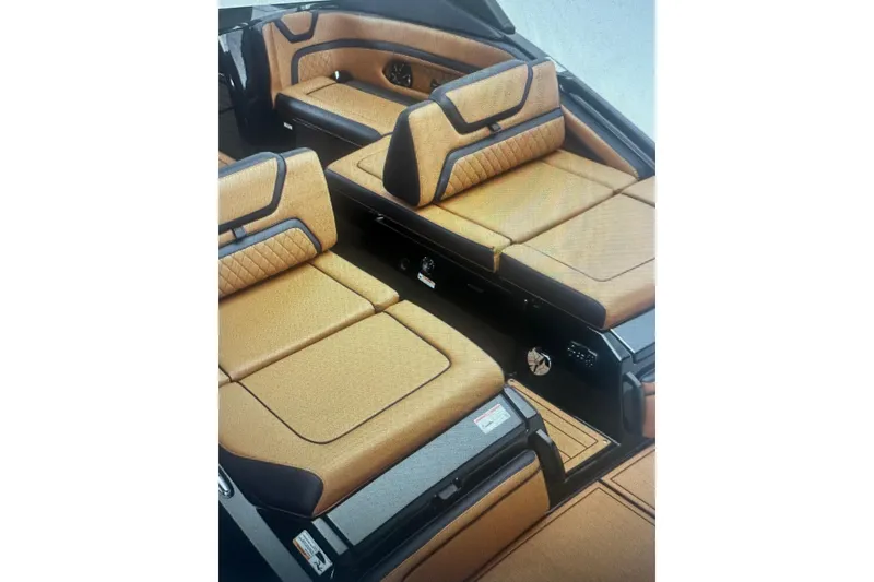 Slide: The Image of Luxurious interior of 2026 Yamaha Boats 275SD with tan and black seating. - 8