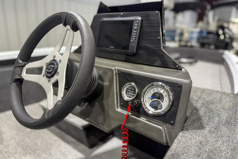 Slide: The Image of 2026 Smoker Craft Viper XR 165 dashboard with steering wheel and gauges. - 6