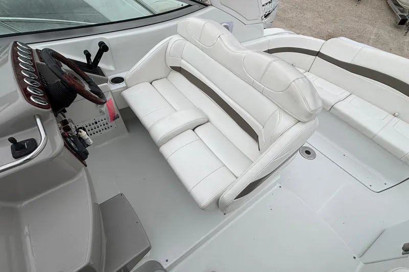 Slide: The Image of 2005 Formula 31 Performance Cruiser interior with white seating and steering wheel. - 11