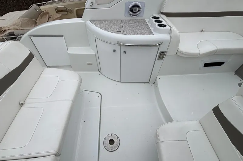 Slide: The Image of 2005 Formula 31 Performance Cruiser interior with white seating and storage cabinets. - 16