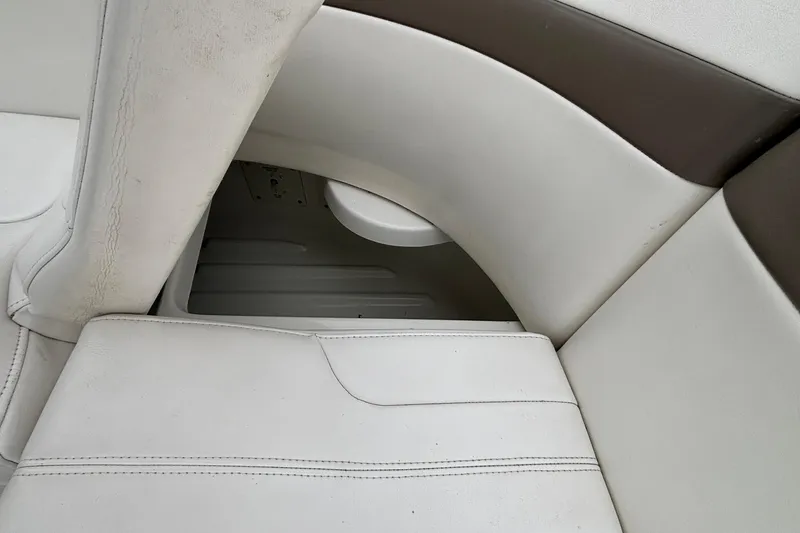 Slide: The Image of 2005 Formula 31 Performance Cruiser interior seating detail, featuring white and brown upholstery. - 18