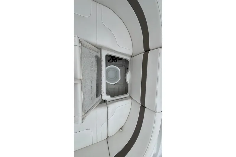 Slide: The Image of 2005 Formula 31 Performance Cruiser interior storage compartment with white and gray seating. - 19