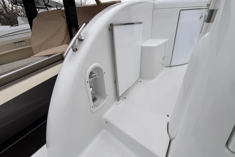 Slide: The Image of 2005 Formula 31 Performance Cruiser interior with white deck and storage compartments. - 23