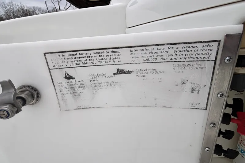 Slide: The Image of 2005 Formula 31 Performance Cruiser with MARPOL treaty compliance notice on waste disposal. - 29