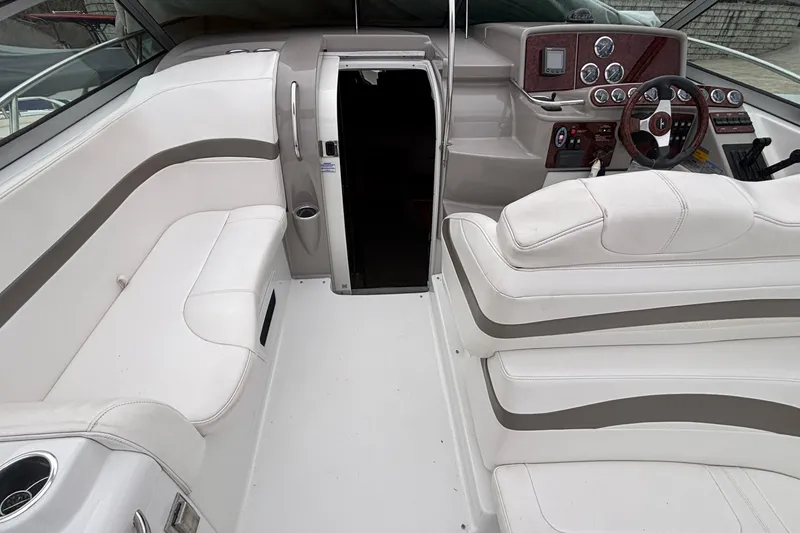 Slide: The Image of 2005 Formula 31 Performance Cruiser interior with white seating and modern dashboard. - 31